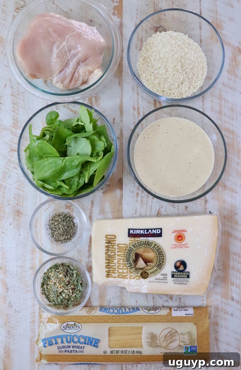 Creamy Chicken Caesar Pasta Recipe for Quick Weeknight Meals 5 ingredients for chicken caesar pasta on a white wood board