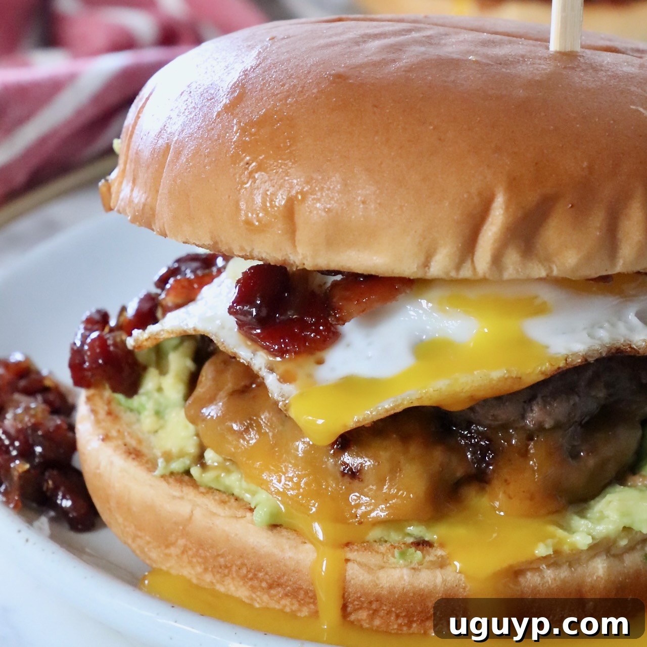 Complete Guide to Crafting Perfect Burgers at Home 15 burger on plate topped with fried egg and bacon jam