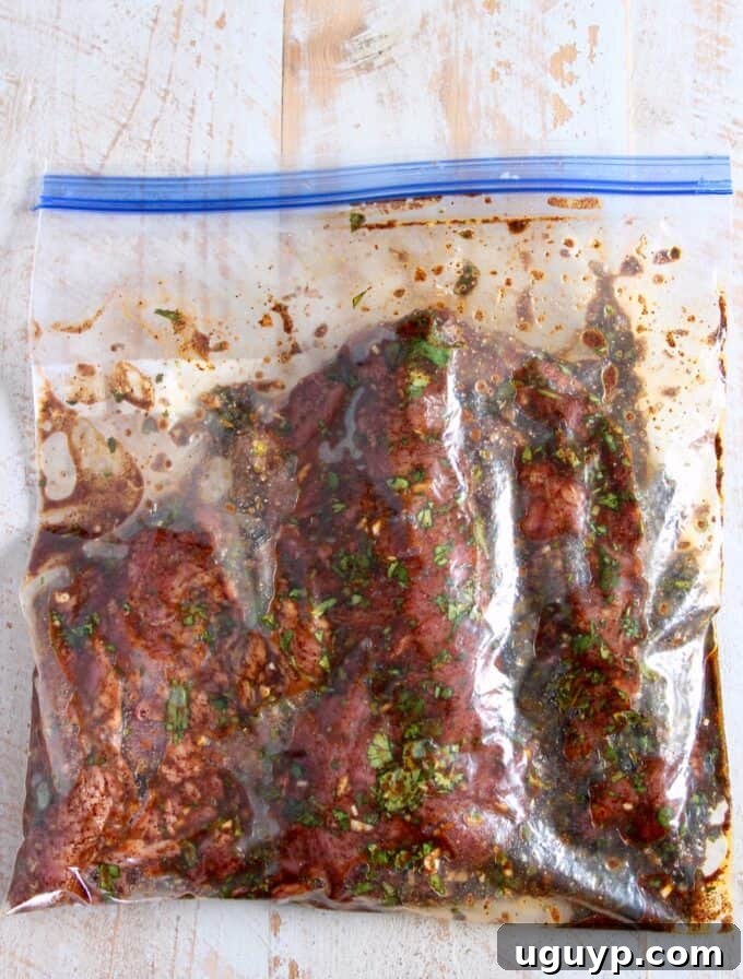 California Burrito Bowl Recipe: Chipotle-Style Carne Asada Bowl 5 marinating carne asada in ziplock bag