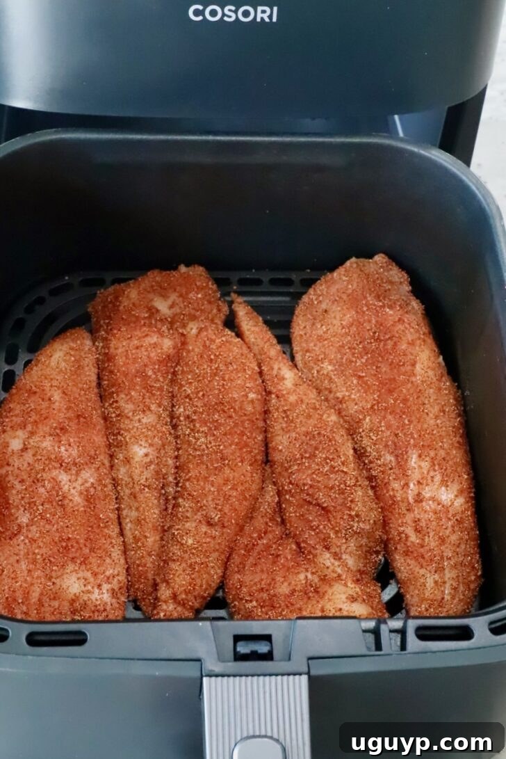 Crispy Buffalo Chicken Salad with Blue Cheese and Ranch 6 seasoned chicken breasts in an air fryer basket