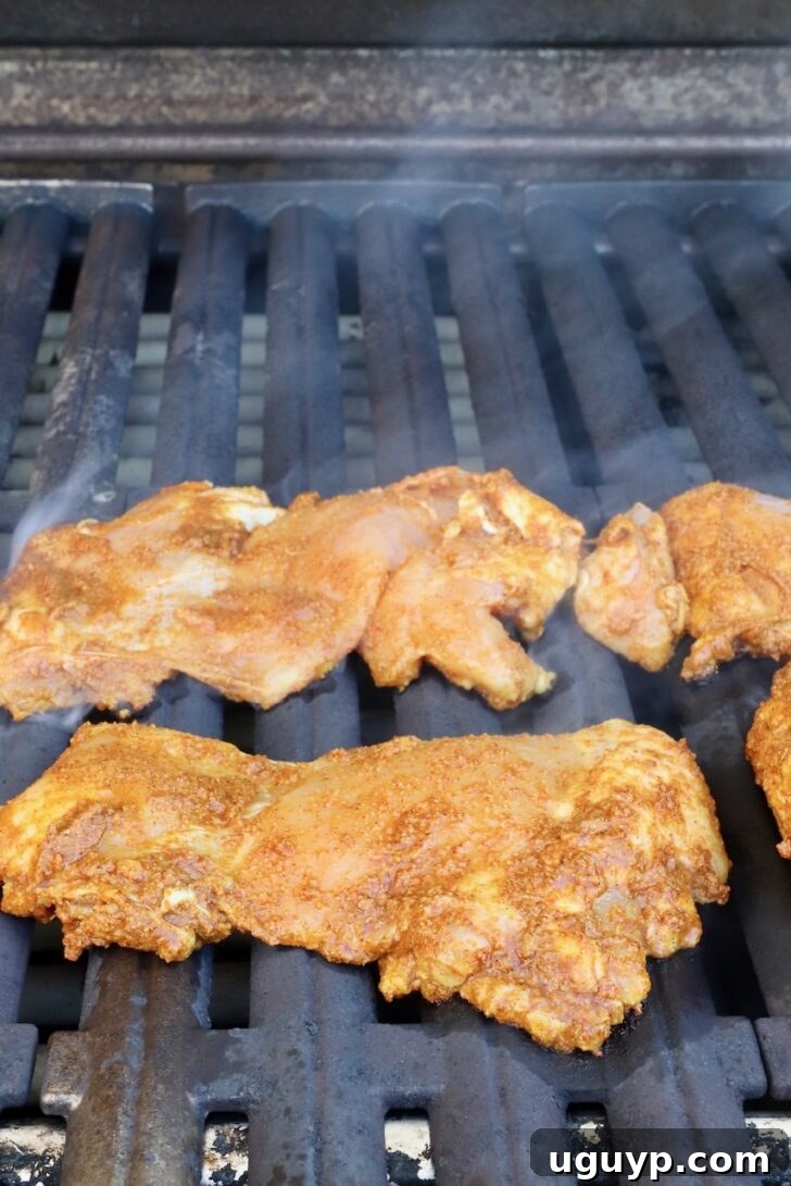 Homemade Chicken Shawarma Tacos Recipe 7 shawarma marinated chicken thighs on a grill