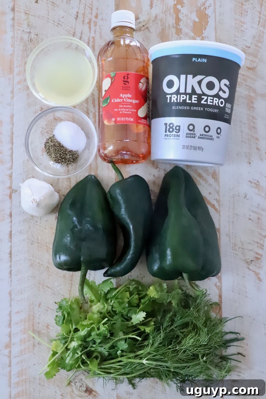 ingredients for poblano ranch dressing on a white wood board