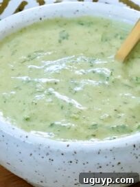 poblano ranch dressing in a small bowl with a spoon
