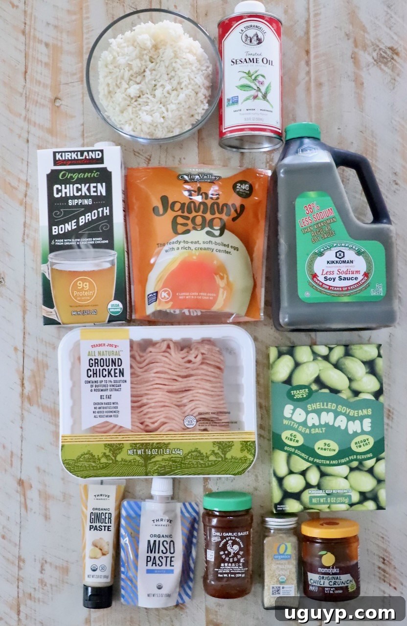 ingredients for miso ginger broth bowls laid out on a white wood surface