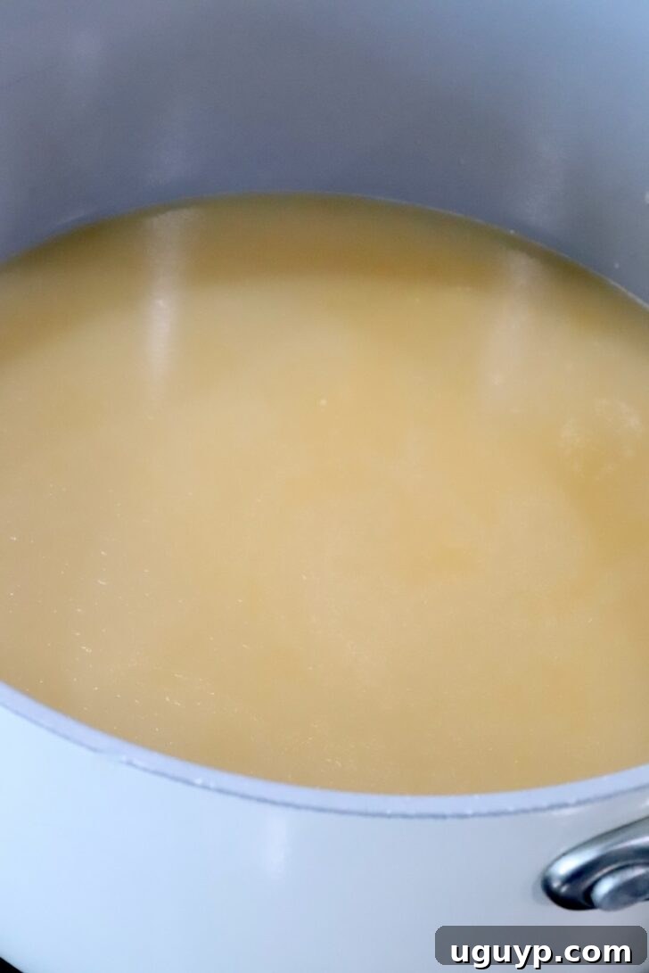 miso ginger chicken bone broth in a pot on the stove